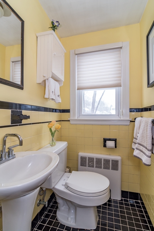 53 Bacon Street Natick, MA 01760 - Photo 14 of 30 a bathroom with a sink a toilet and a bathtub