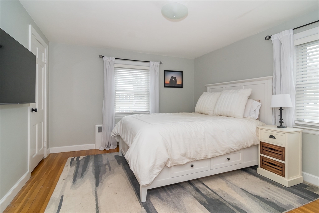 53 Bacon Street Natick, MA 01760 - Photo 15 of 30 a bed room with a bed and a tv