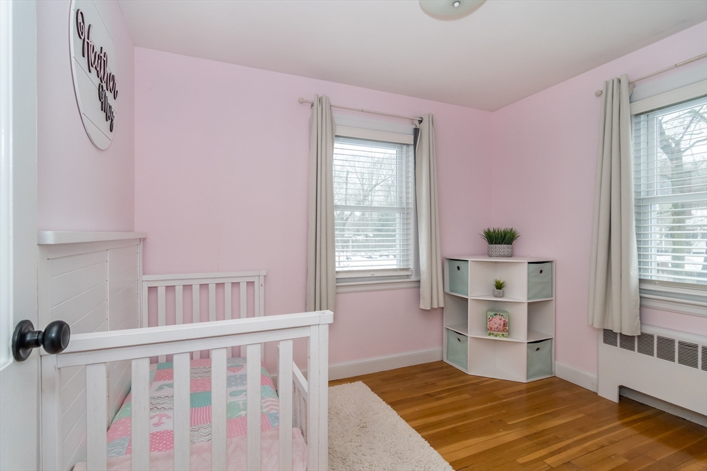 53 Bacon Street Natick, MA 01760 - Photo 18 of 30 a bedroom with a bed and a window