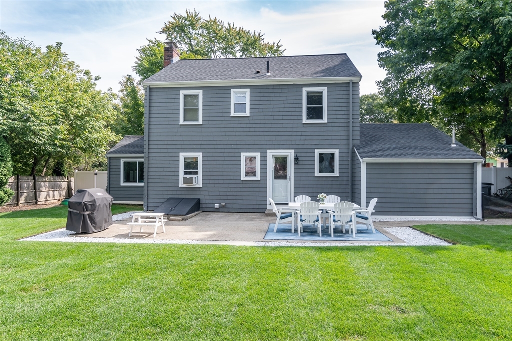 53 Bacon Street Natick, MA 01760 - Photo 24 of 30 a front view of house with yard and outdoor seating