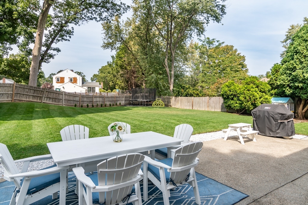 53 Bacon Street Natick, MA 01760 - Photo 26 of 30 a view of a patio with garden and furniture