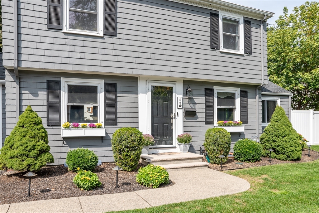 53 Bacon Street Natick, MA 01760 - Photo 4 of 30 a front view of a house with garden