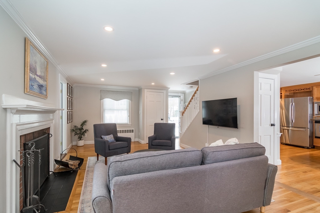 53 Bacon Street Natick, MA 01760 - Photo 7 of 30 a living room with furniture and a flat screen tv