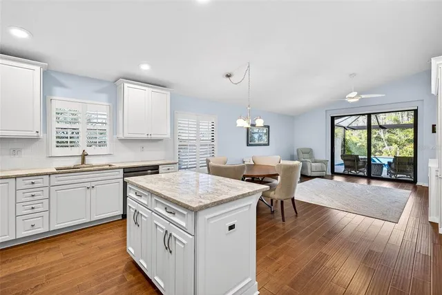 an aerial view of residential houses with outdoor space and swimming pool
