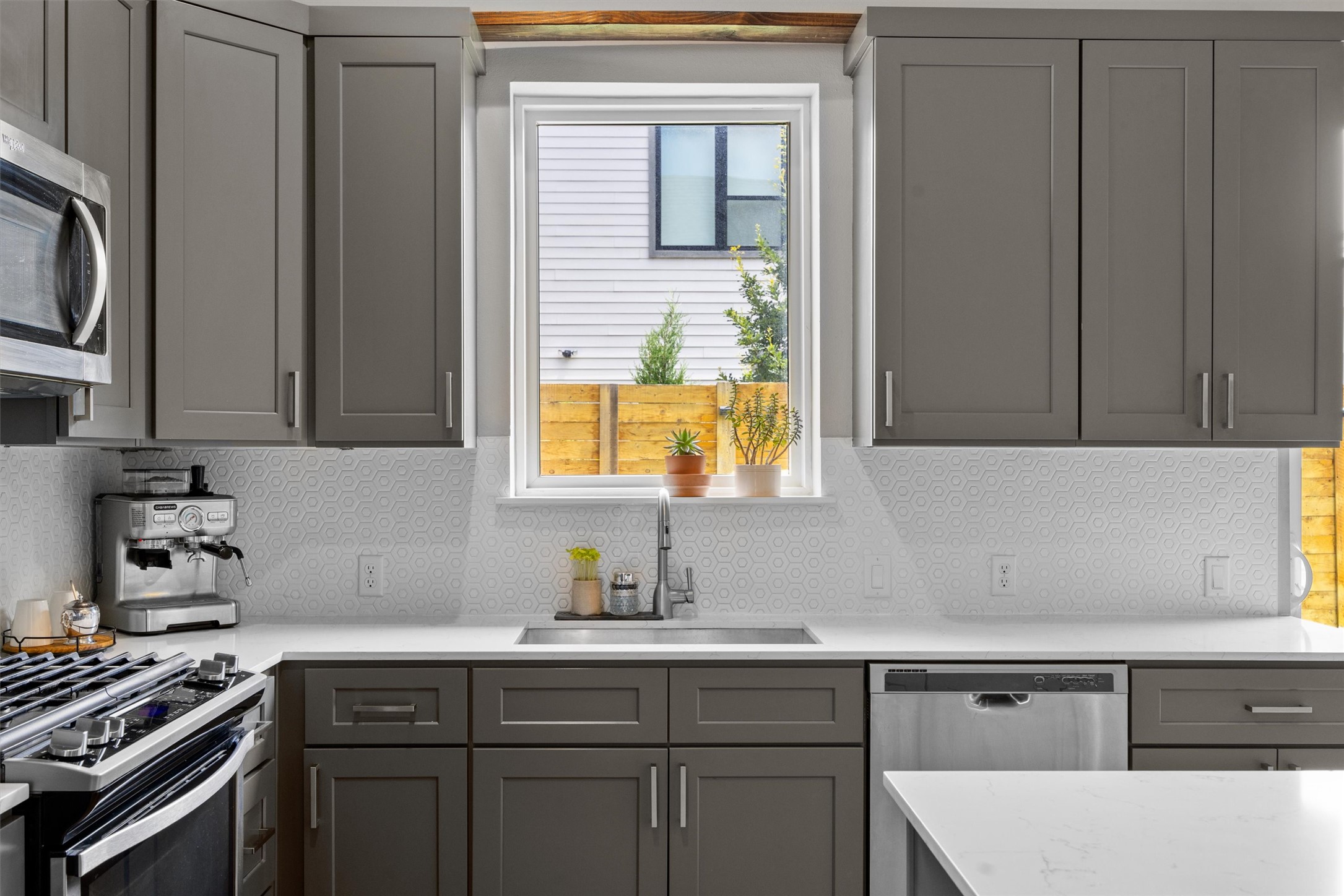 1116 Stobaugh Street, Unit B Austin, TX 78757 - Photo 12 of 38 Large windows and bright finishes help the space feel light and inviting throughout the day.