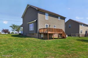 338 Pistole Road Sparta, TN 38583 - Photo 32 of 39 a view of a house with a yard and deck
