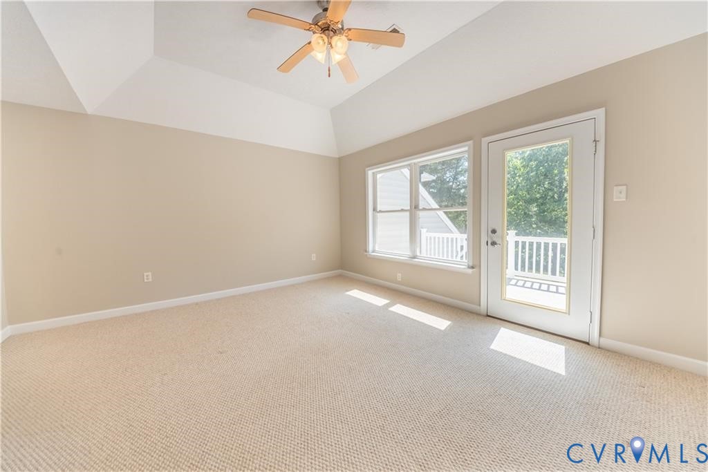 330 Chesapeake Watch Road, Unit 10B Deltaville, VA 23043 - Photo 18 of 48 an empty room with windows and chandelier fan