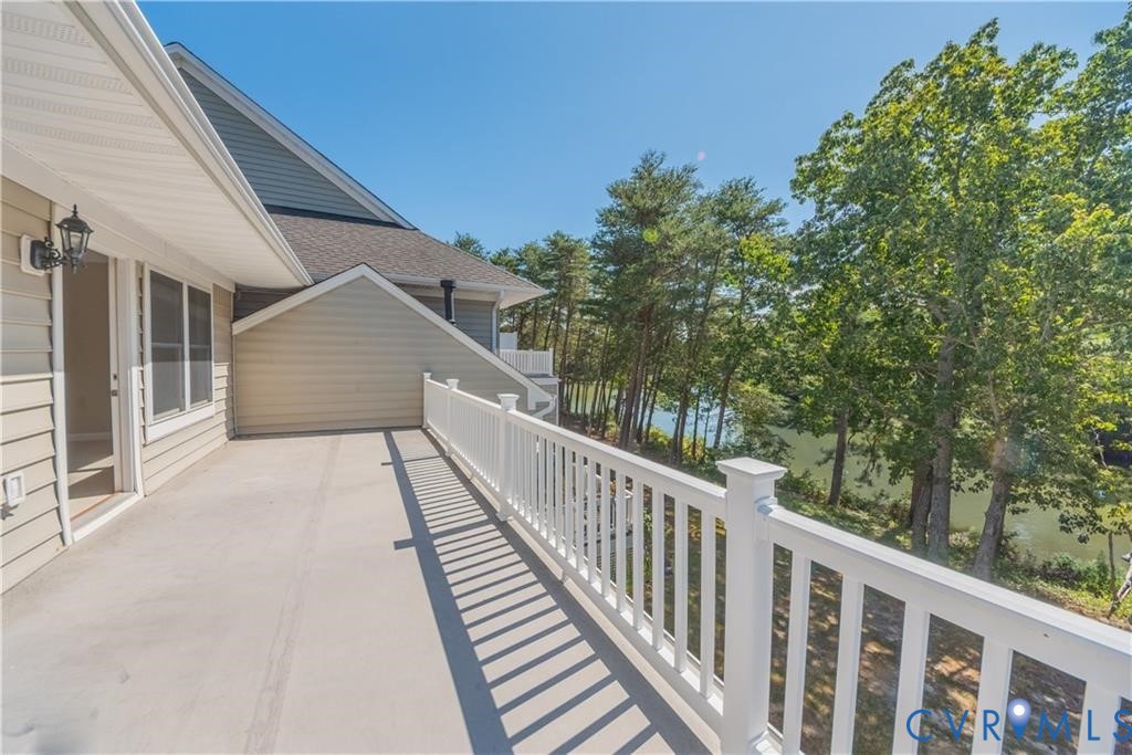 330 Chesapeake Watch Road, Unit 10B Deltaville, VA 23043 - Photo 19 of 48 a view of a balcony with wooden floor and fence