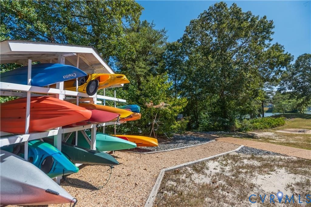 330 Chesapeake Watch Road, Unit 10B Deltaville, VA 23043 - Photo 26 of 48 an outdoor space with patio and white umbrellas