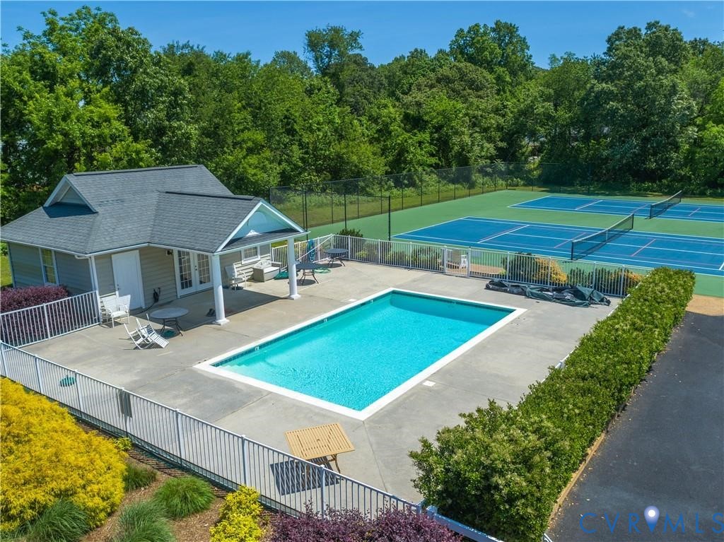 330 Chesapeake Watch Road, Unit 10B Deltaville, VA 23043 - Photo 32 of 48 a view of a house with pool and yard