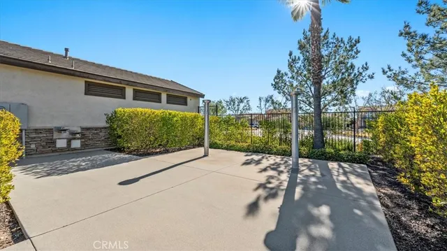 a view of a backyard with potted plants