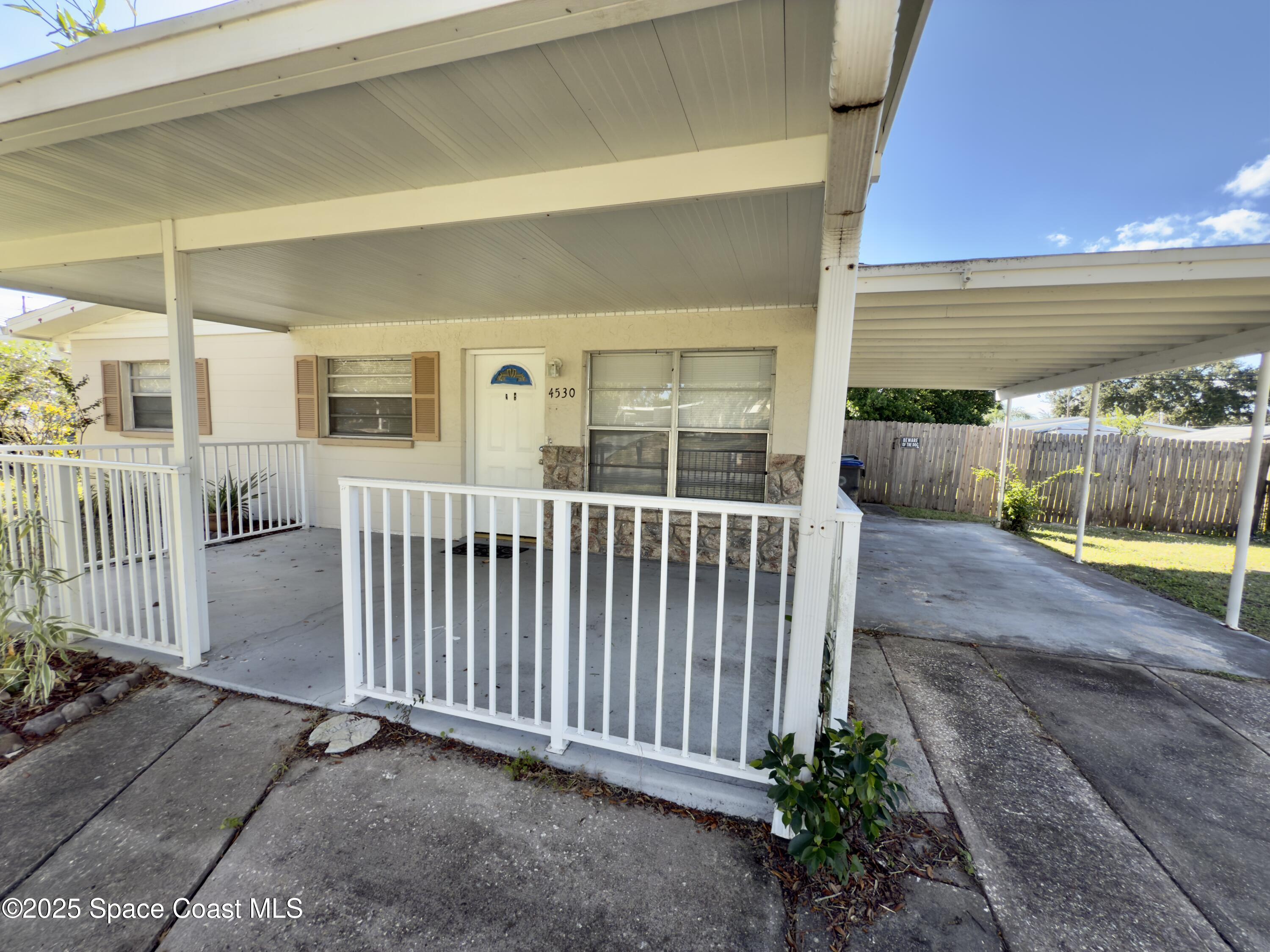 4530 Coleridge Avenue Titusville, FL 32780 - Photo 3 of 14 covered front porch