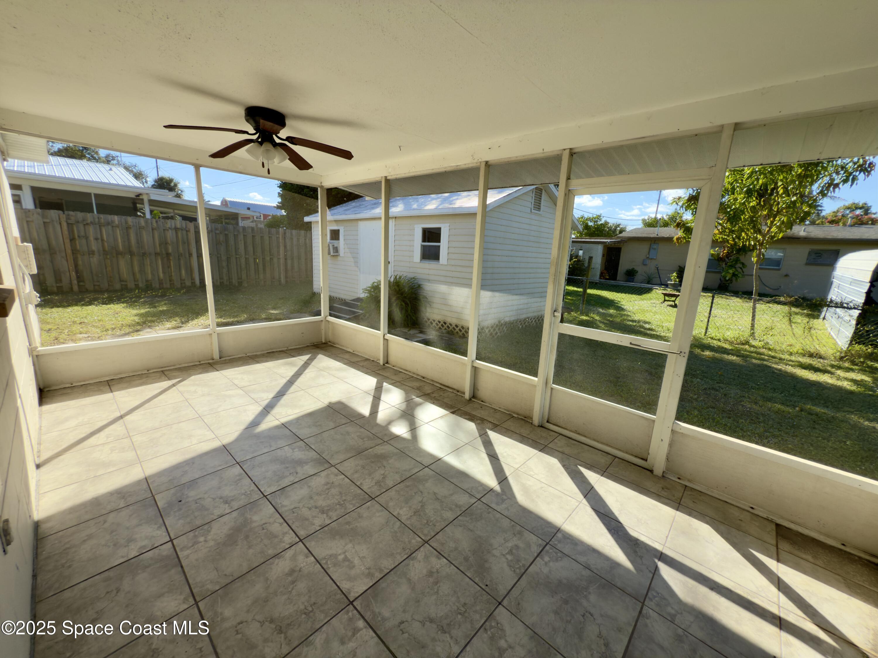 4530 Coleridge Avenue Titusville, FL 32780 - Photo 7 of 14 large screened porch