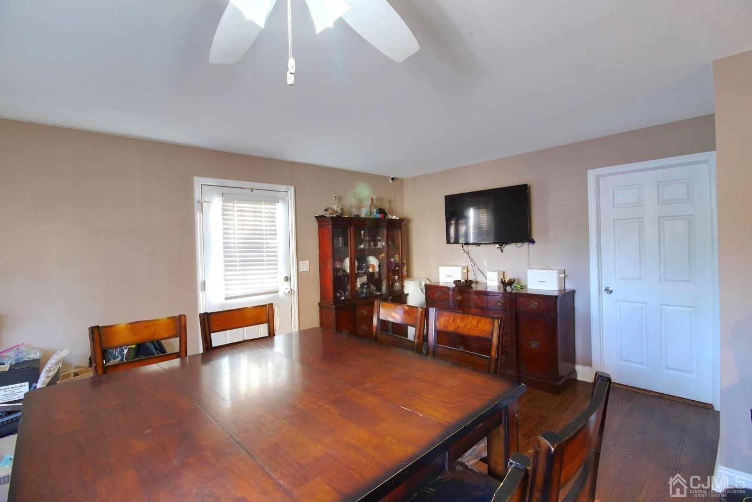 225 New Dover Road Colonia, NJ 07067 - Photo 11 of 33 a view of a livingroom with furniture and a flat screen tv