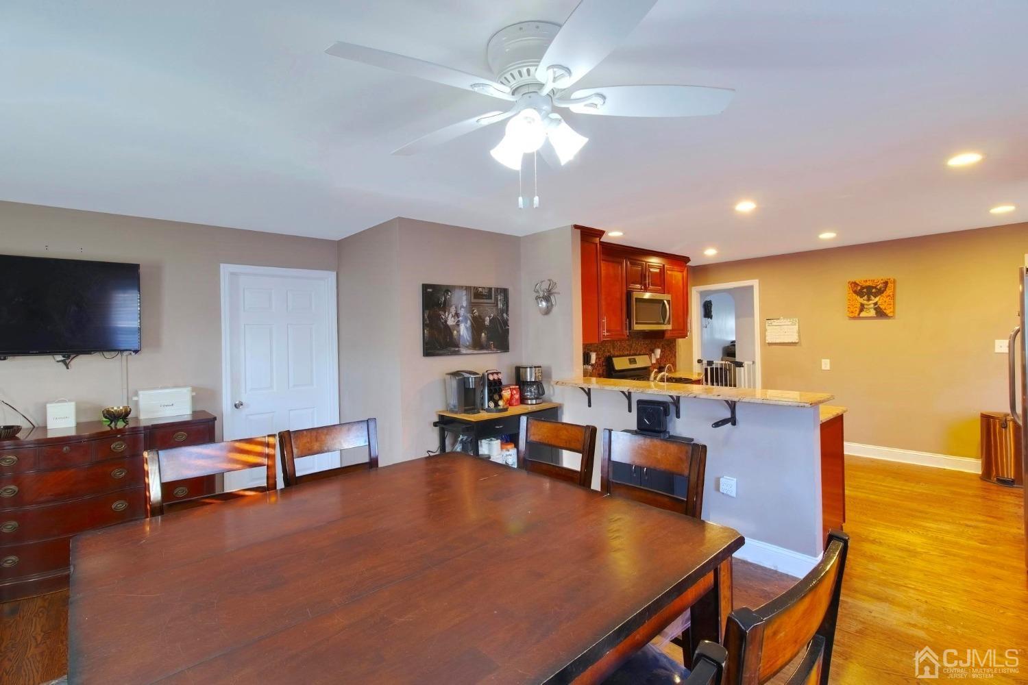 225 New Dover Road Colonia, NJ 07067 - Photo 12 of 33 a living room with furniture and a flat screen tv
