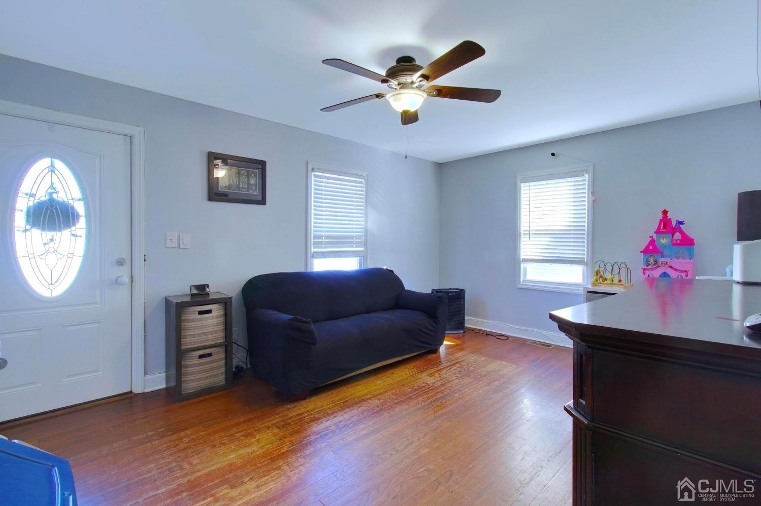225 New Dover Road Colonia, NJ 07067 - Photo 4 of 33 a living room with furniture and a window