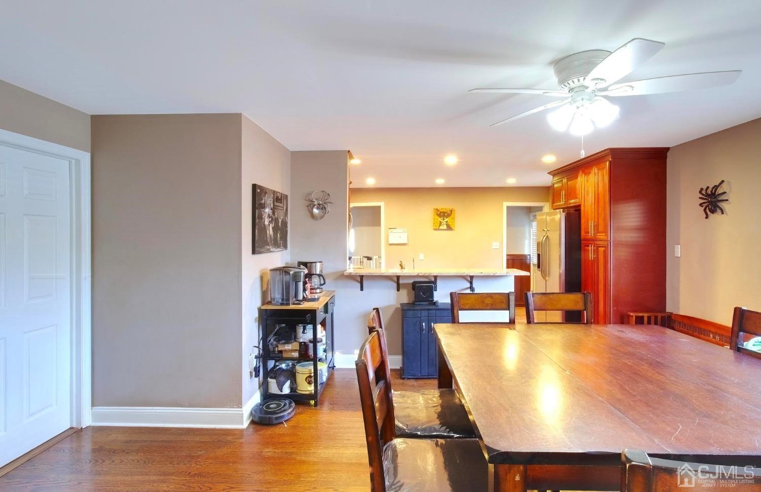 225 New Dover Road Colonia, NJ 07067 - Photo 10 of 33 a view of a dining room with furniture and wooden floor