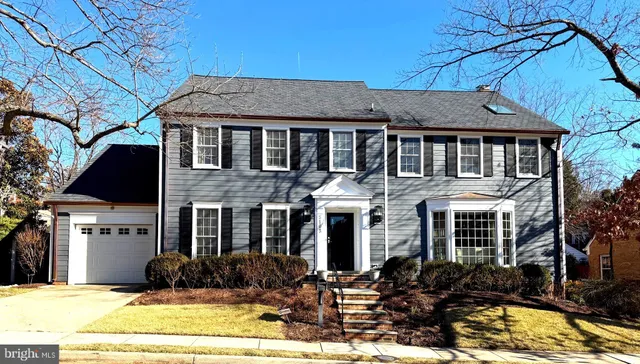 a front view of a house with yard