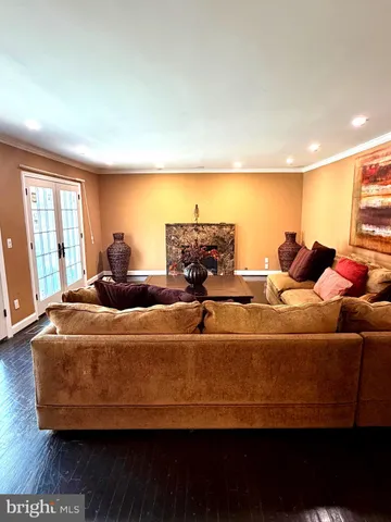 a living room with furniture and large window