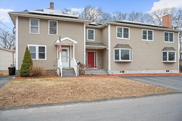 a front view of a house with a yard
