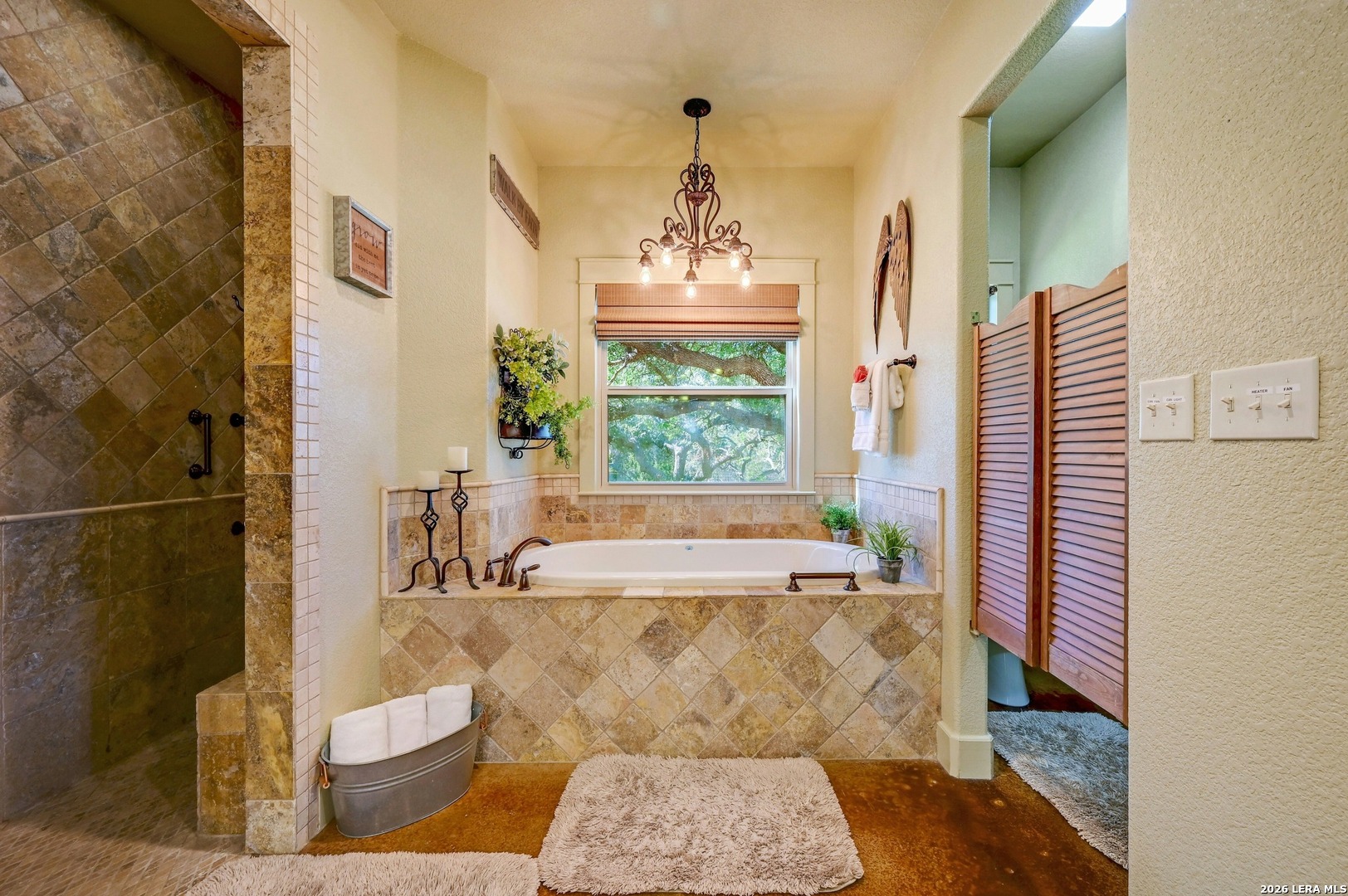 316 Go Away Road Blanco, TX 78606 - Photo 26 of 40 a spacious bathroom with a bathtub and window