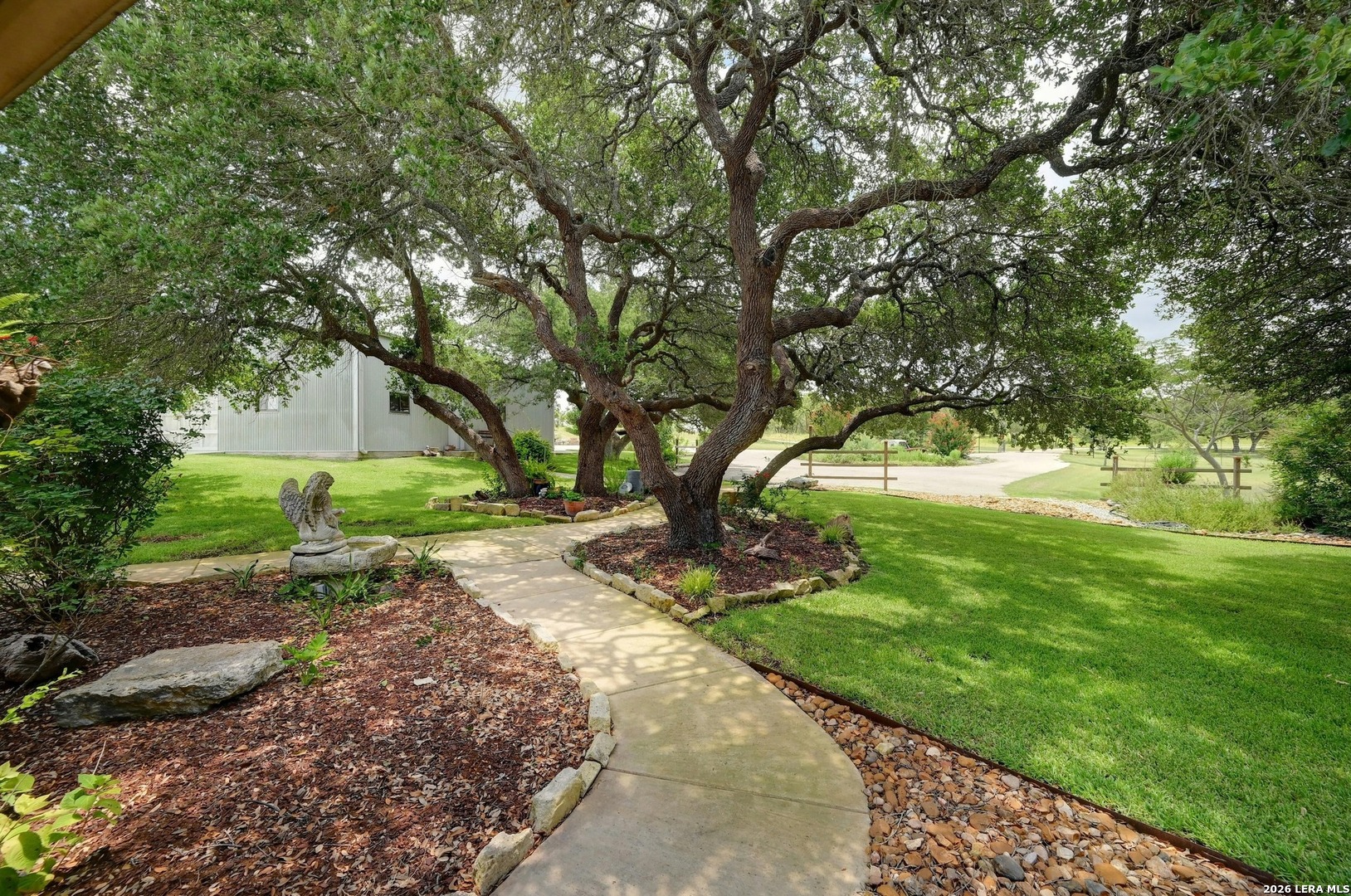 316 Go Away Road Blanco, TX 78606 - Photo 37 of 40 a view of a garden with trees