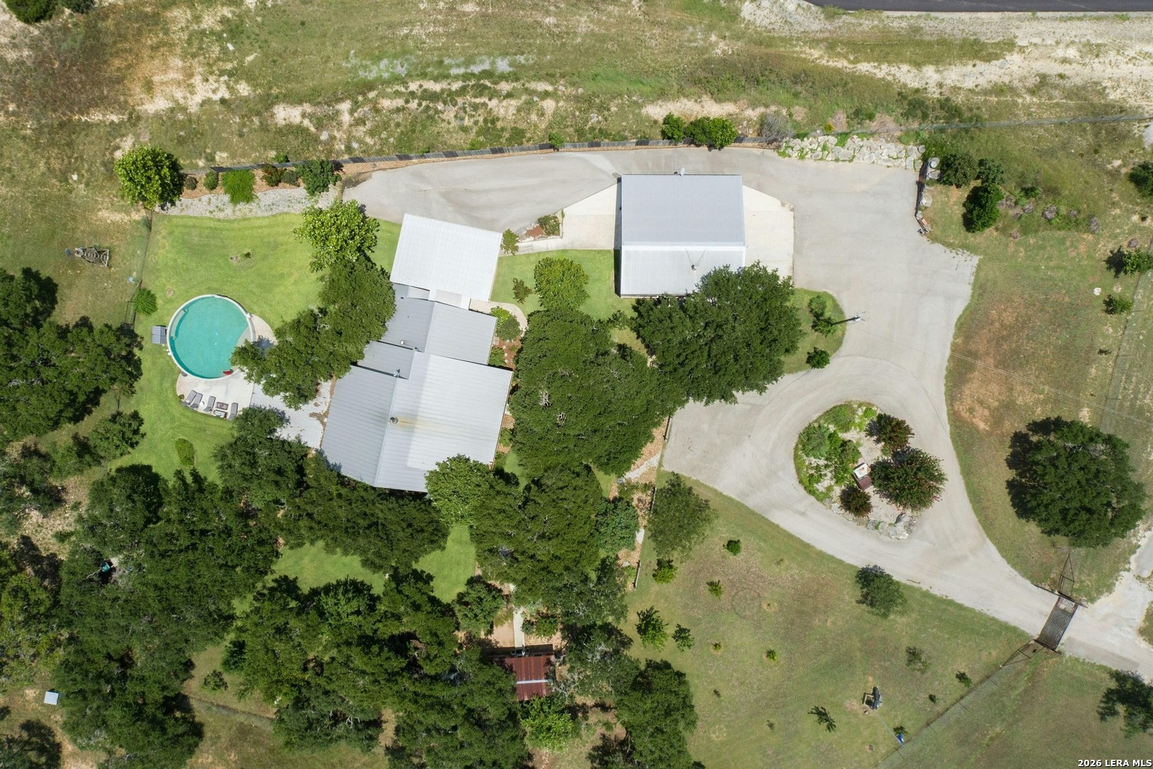 316 Go Away Road Blanco, TX 78606 - Photo 38 of 40 an aerial view of a house with a yard
