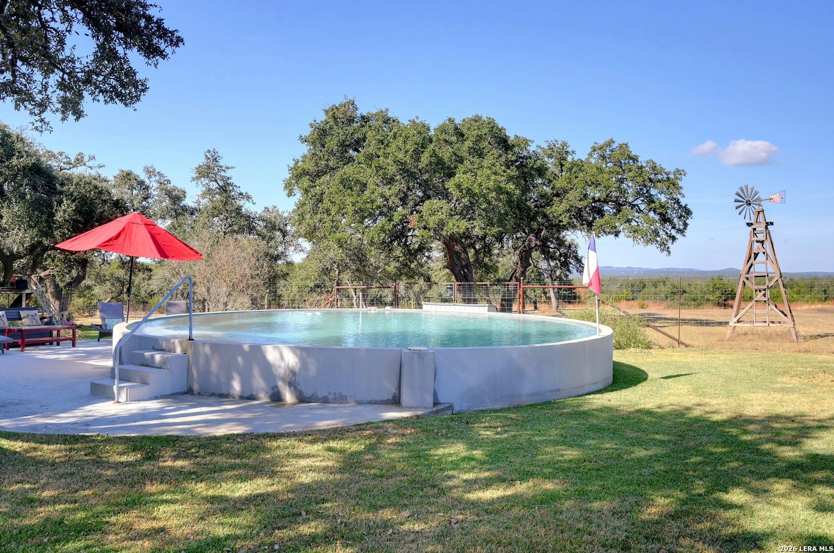 316 Go Away Road Blanco, TX 78606 - Photo 5 of 40 a view of swimming pool with a yard