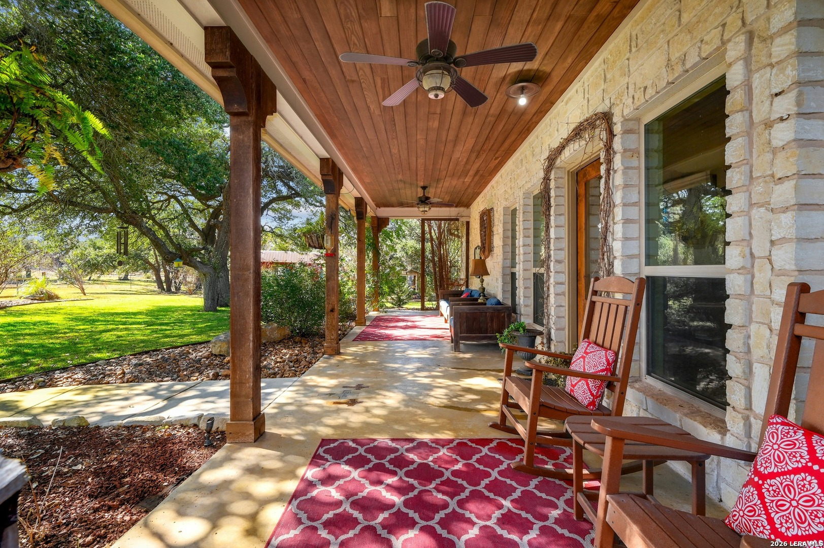316 Go Away Road Blanco, TX 78606 - Photo 8 of 40 a view of a porch with chairs and backyard