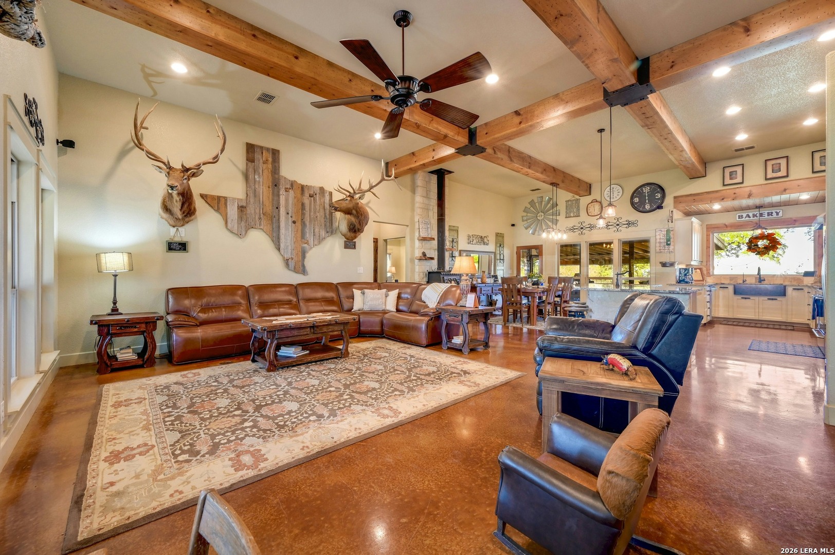 316 Go Away Road Blanco, TX 78606 - Photo 10 of 40 a living room with lots of furniture and a chandelier