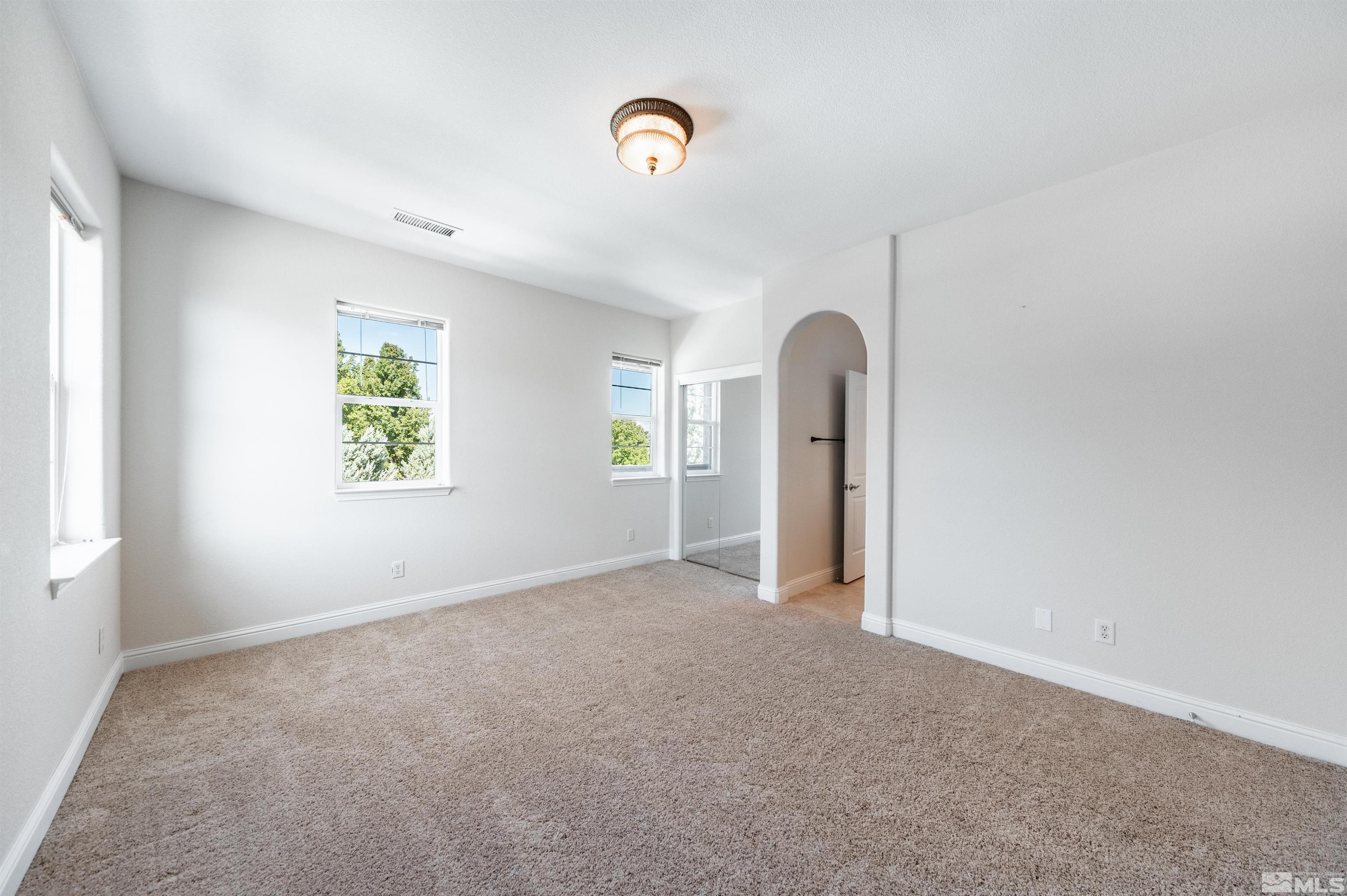 985 Bella Monte Drive Minden, NV 89423 - Photo 14 of 37 an empty room with windows and closet