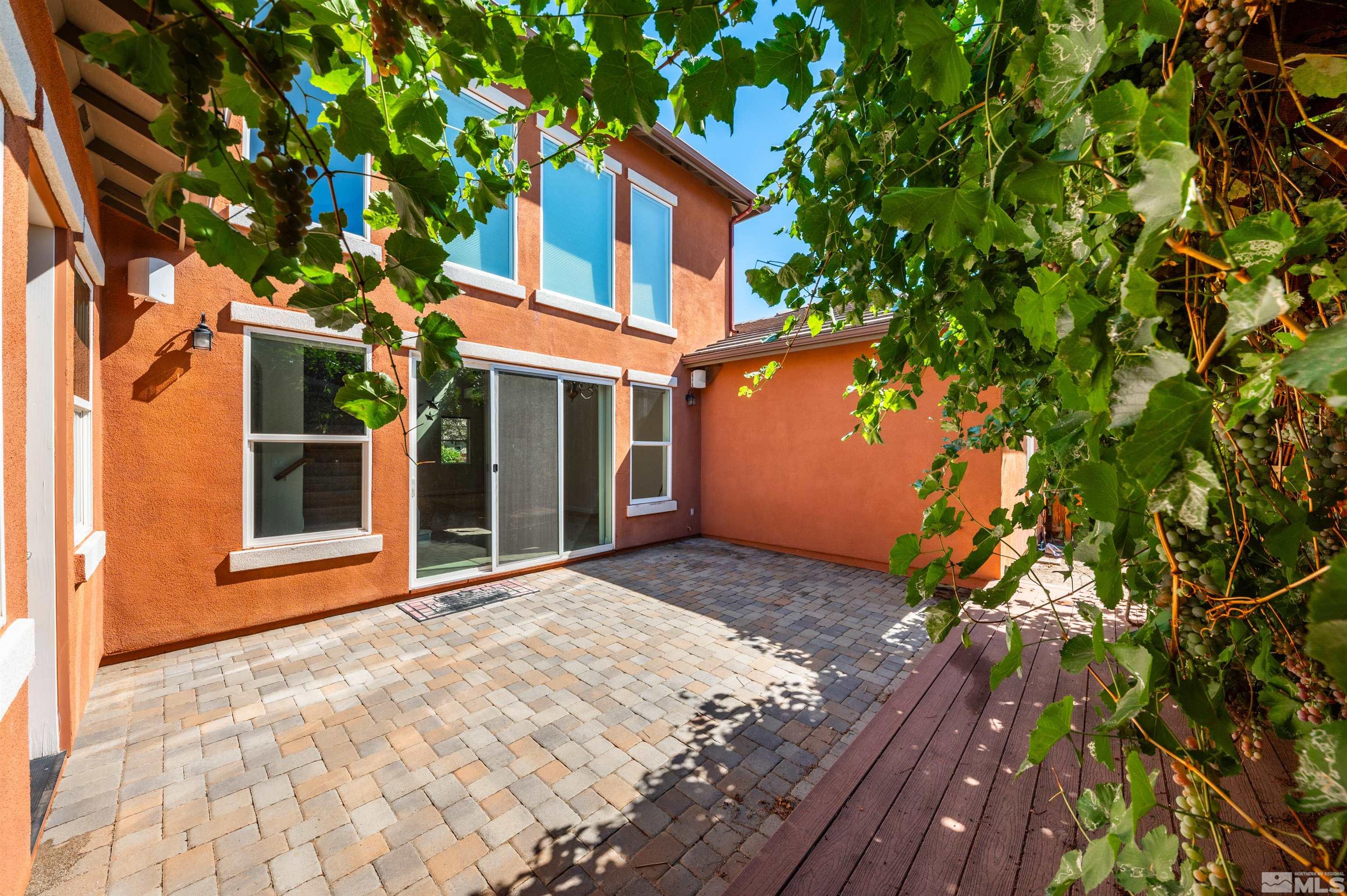 985 Bella Monte Drive Minden, NV 89423 - Photo 21 of 37 a front view of a house with a yard and garage