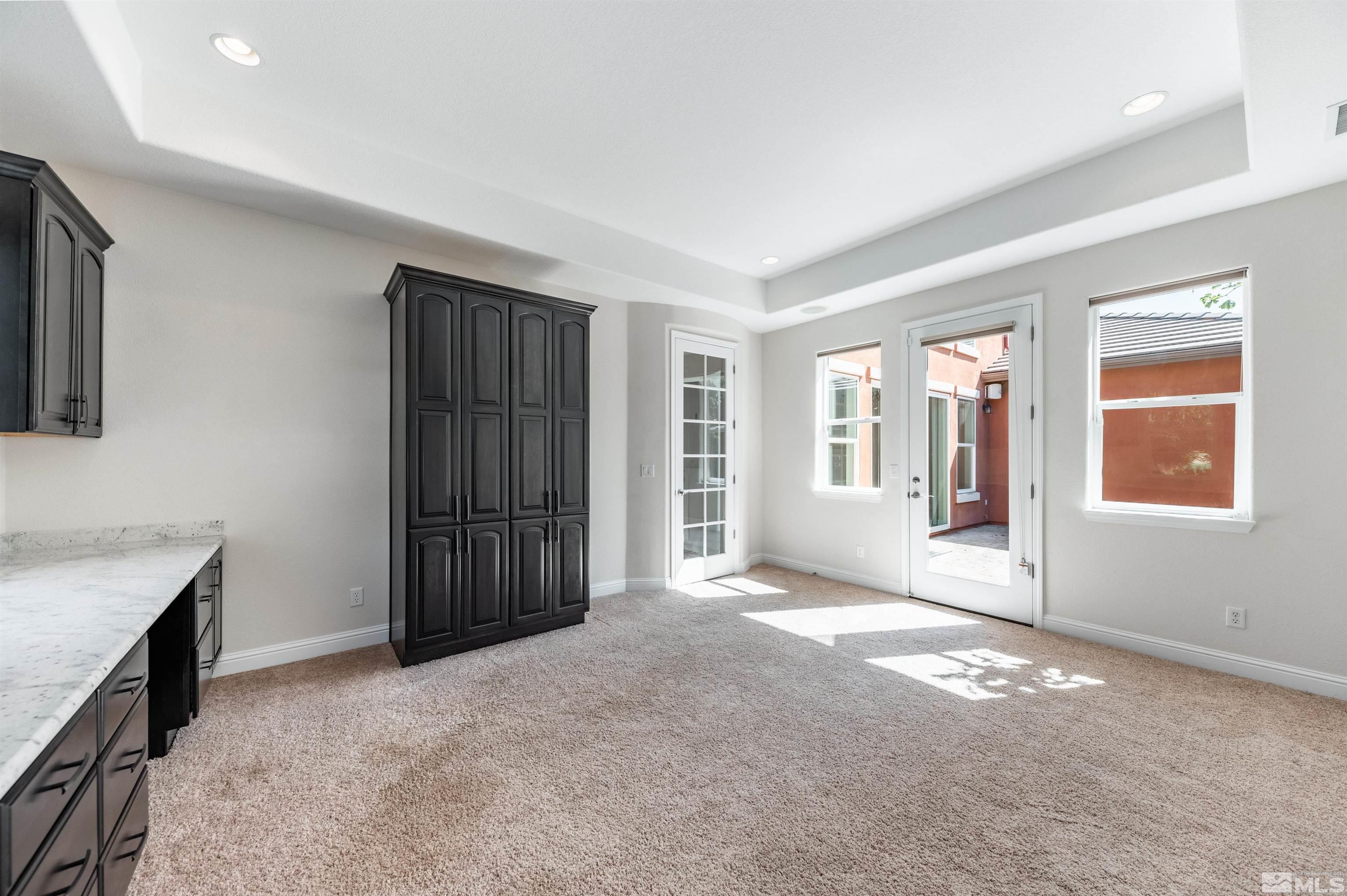 985 Bella Monte Drive Minden, NV 89423 - Photo 26 of 37 a view of an empty room with a window and a kitchen
