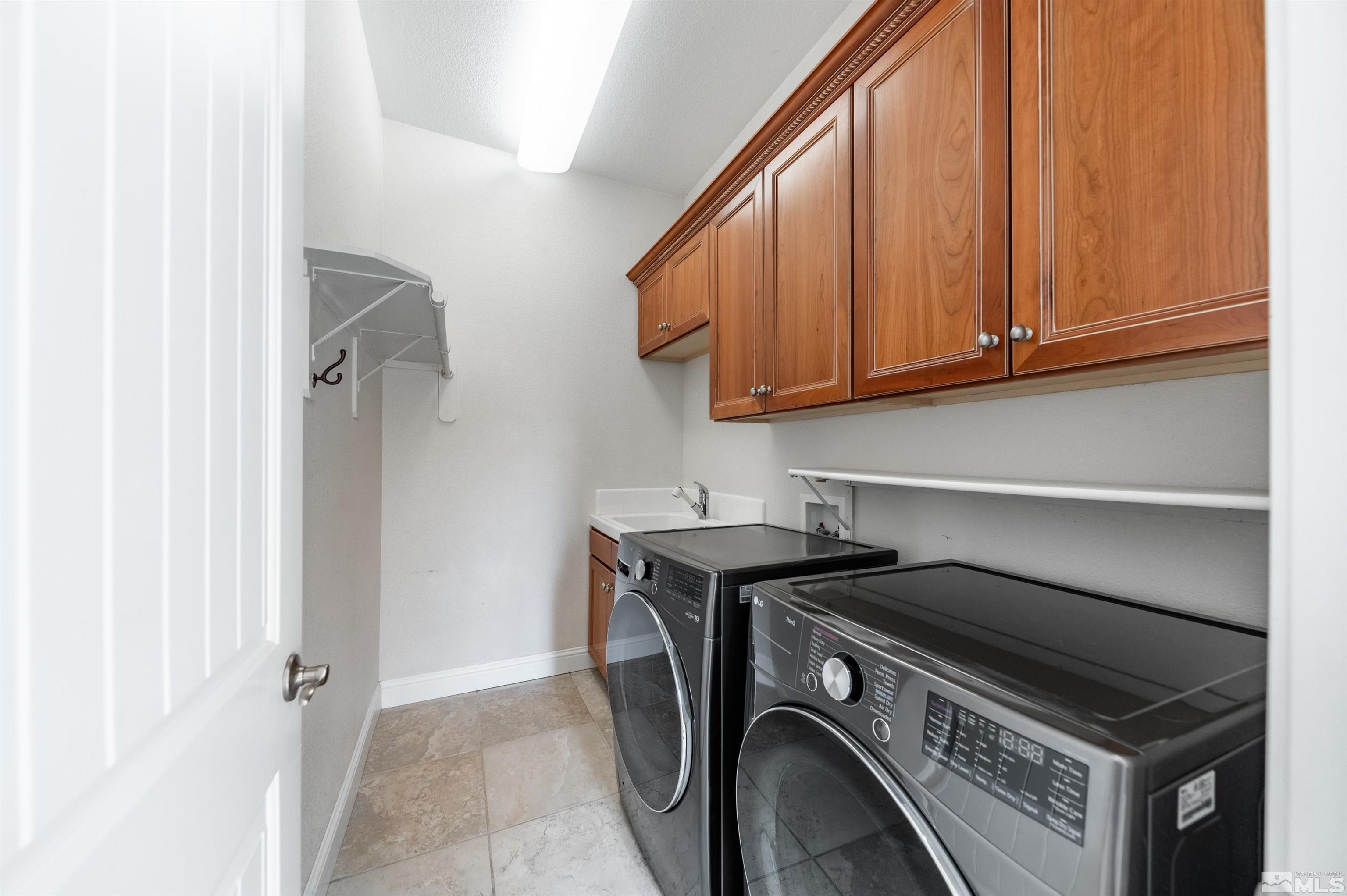 985 Bella Monte Drive Minden, NV 89423 - Photo 30 of 37 a utility room with dryer and washer