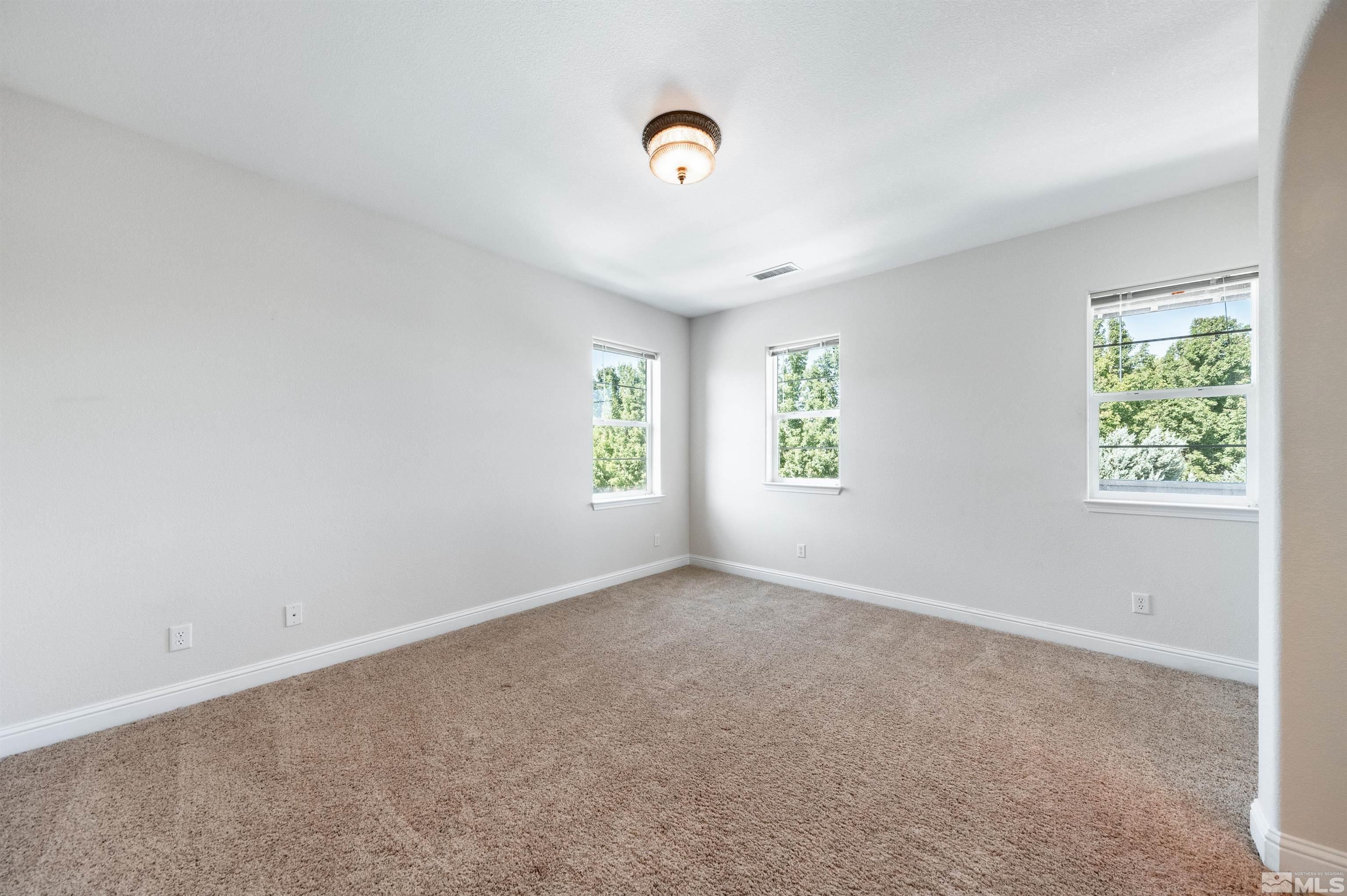 985 Bella Monte Drive Minden, NV 89423 - Photo 32 of 37 an empty room with windows