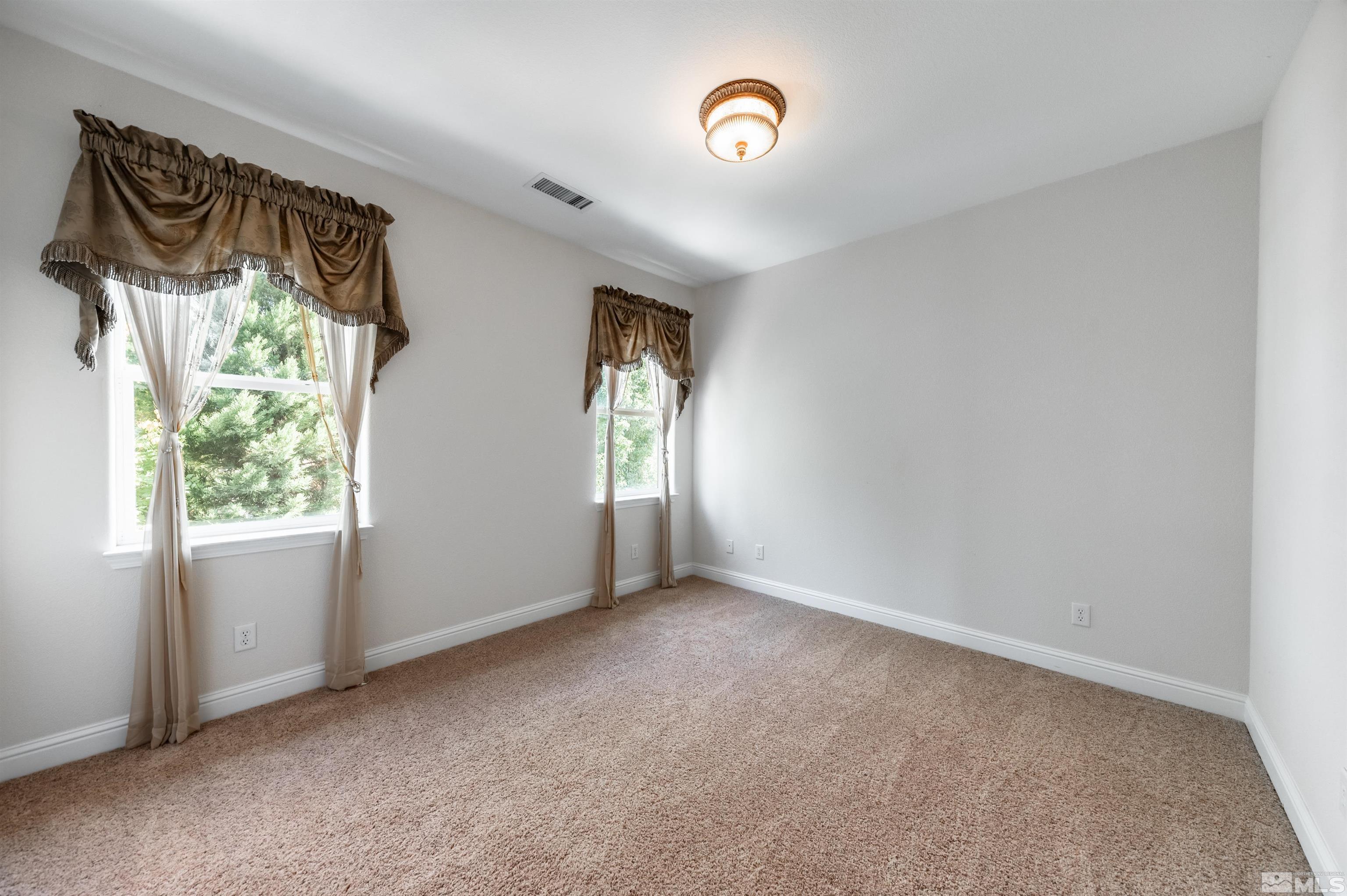 985 Bella Monte Drive Minden, NV 89423 - Photo 34 of 37 an empty room with windows