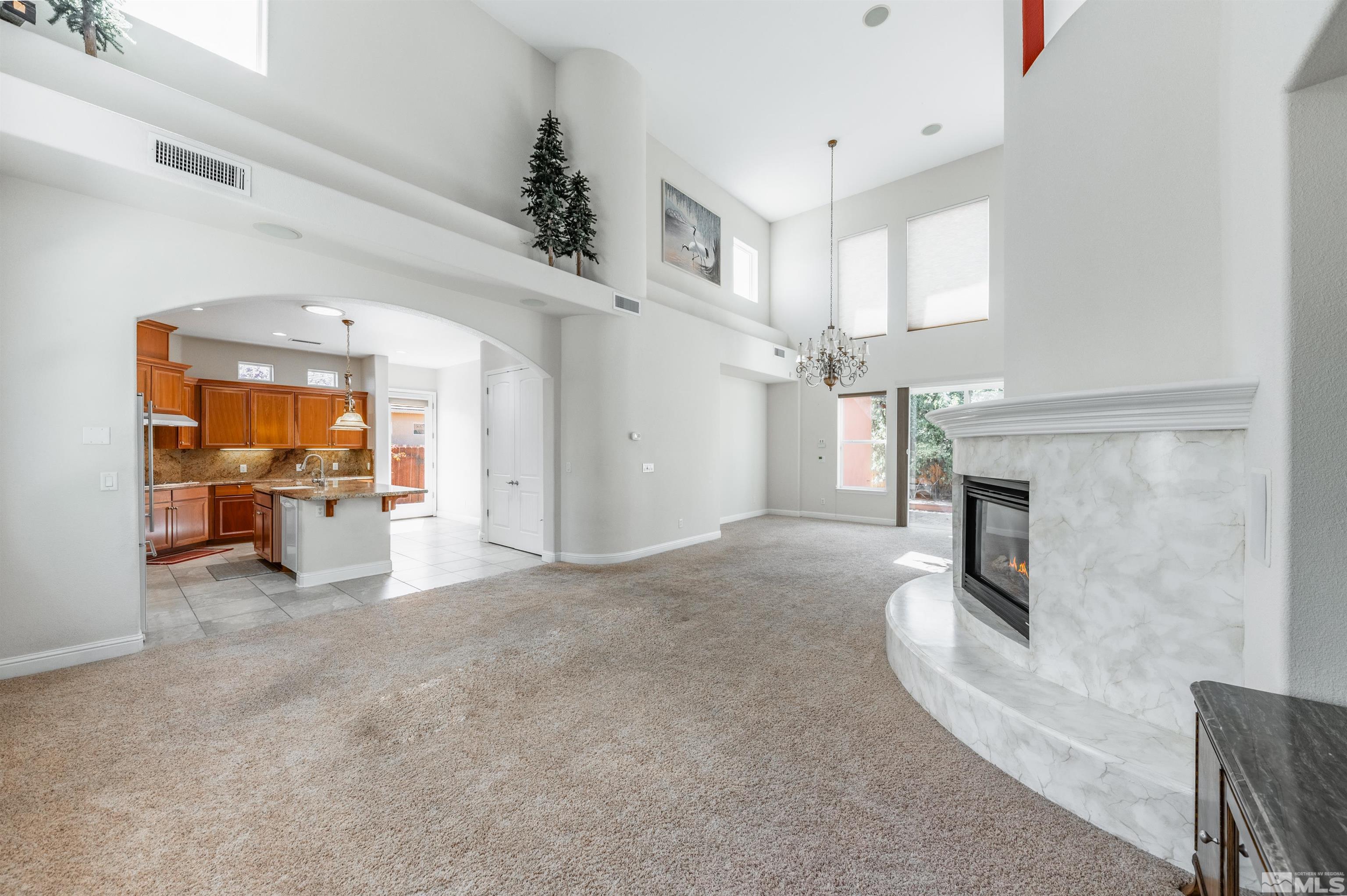 985 Bella Monte Drive Minden, NV 89423 - Photo 7 of 37 a view of a livingroom with an empty space and a fireplace