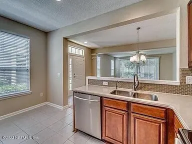 a kitchen with a sink and a window