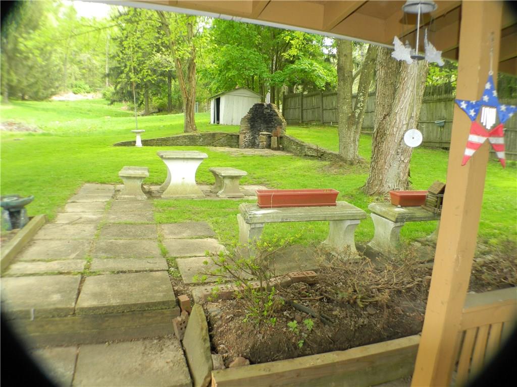 822-828 Hulton Road Verona, PA 15147 - Photo 19 of 22 822 Hulton - Looking out from back porch. Enjoy your morning coffee in this picturesque setting while listening to the birds sing!