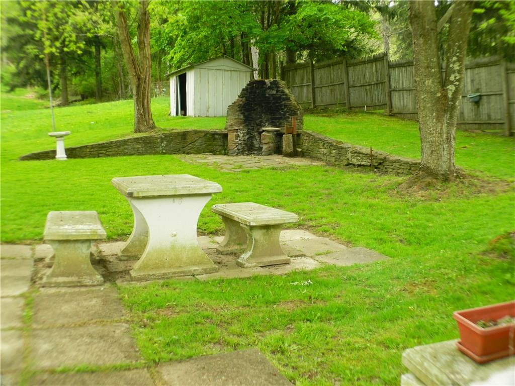 822-828 Hulton Road Verona, PA 15147 - Photo 20 of 22 Eye catching! Outdoor fireplace, hand built. What is better than a crackling fire on a cool night?