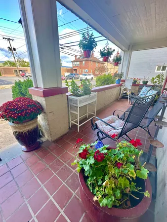 a outdoor living space with furniture and a fireplace