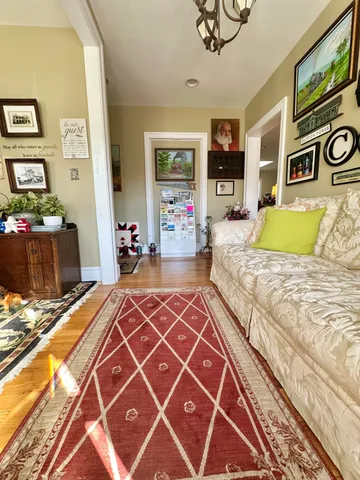 a living room with furniture and a table