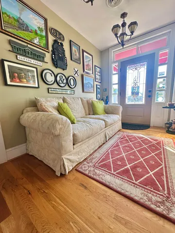 a living room with lots of furniture and a table