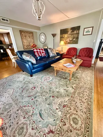 a living room with a couch and a rug