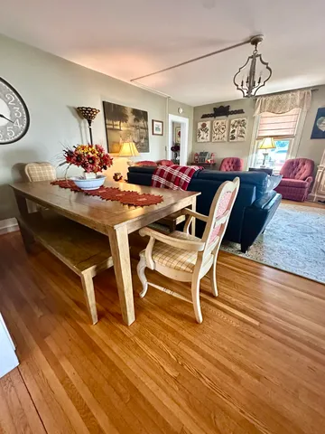 a bedroom with window bed and a chandelier