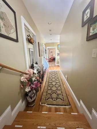 a bathroom with a sink mirror vanity and toilet