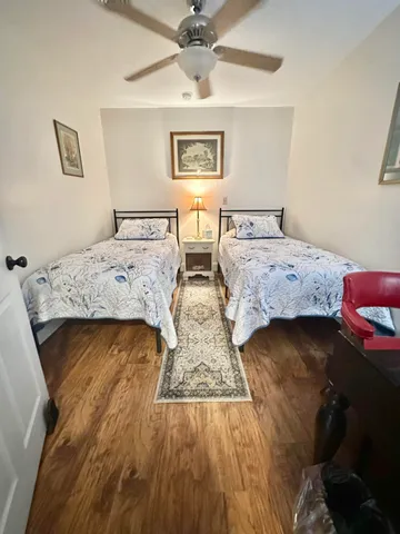 a table with white and a pool table and chairs