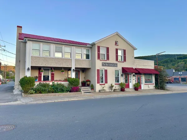 a outdoor living space with furniture and rug