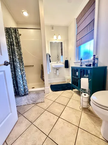 a front view of a house with outdoor seating