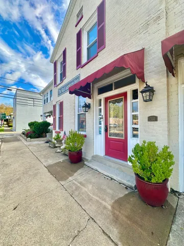 a bedroom with a large bed and a couch